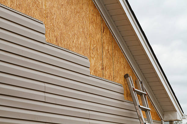 Professional Siding Contractor technician working in Fairview, NJ
